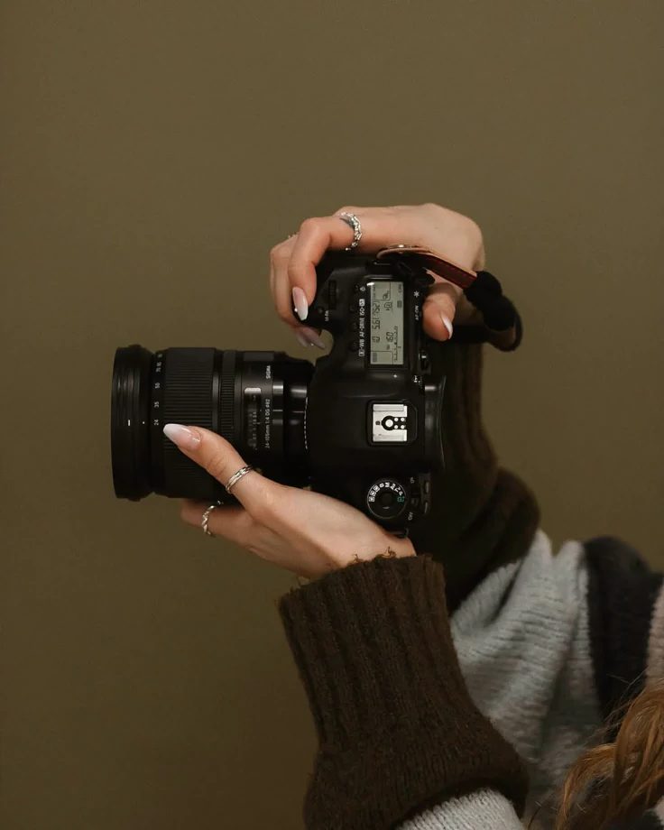 A storyteller with a camera in hand, waiting to be let in